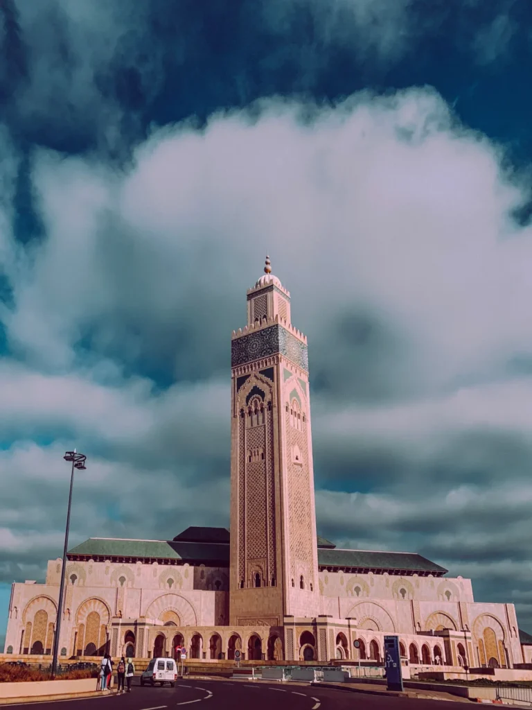 The minaret of the Hassan II Mosque in Casablanca under dramatic clouds