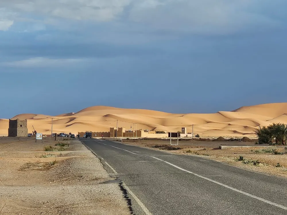 The road into Merzouga, with the Erg Chebbi dunes on the horizon